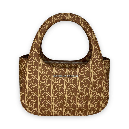 Luxury vegan leather Handbag crafted from with Camille Ardant’s signature Lord print. Zipper closure. The bag comes with two detachable crossbody straps: one chain detail strap and one adjustable shoulder strap. Silver hardware and twill fabric lining One interior zip pocket. One interior slip pocket Dimensions: 9.8” (25cm) Width x 4” (10cm) Depth x 6.7 (17cm) Height. Top handle 5” drop. Chain detail strap 23.5” (60cm) drop.