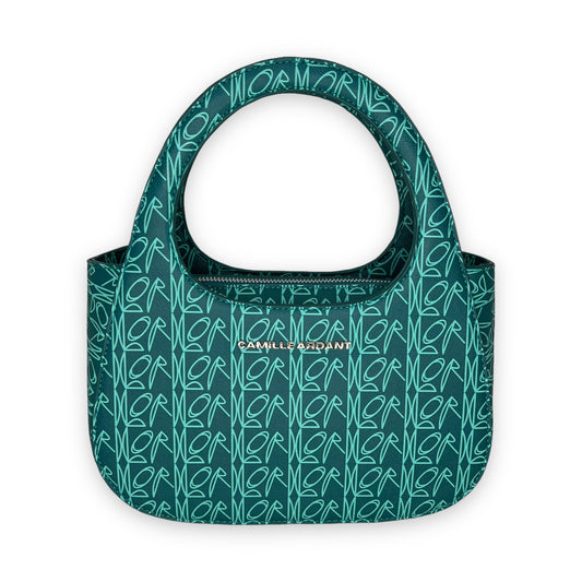 Luxury vegan leather shoulder bag crafted from with Camille Ardant’s signature Lord print. Zipper closure. The bag comes with two detachable crossbody straps: one chain detail strap and one adjustable shoulder strap. Silver hardware and twill fabric lining One interior zip pocket. One interior slip pocket Dimensions: 9.8” (25cm) Width x 4” (10cm) Depth x 6.7 (17cm) Height. Top handle 5” drop. Chain detail strap 23.5” (60cm) drop.
